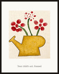 Framed watering can artwork on a wall