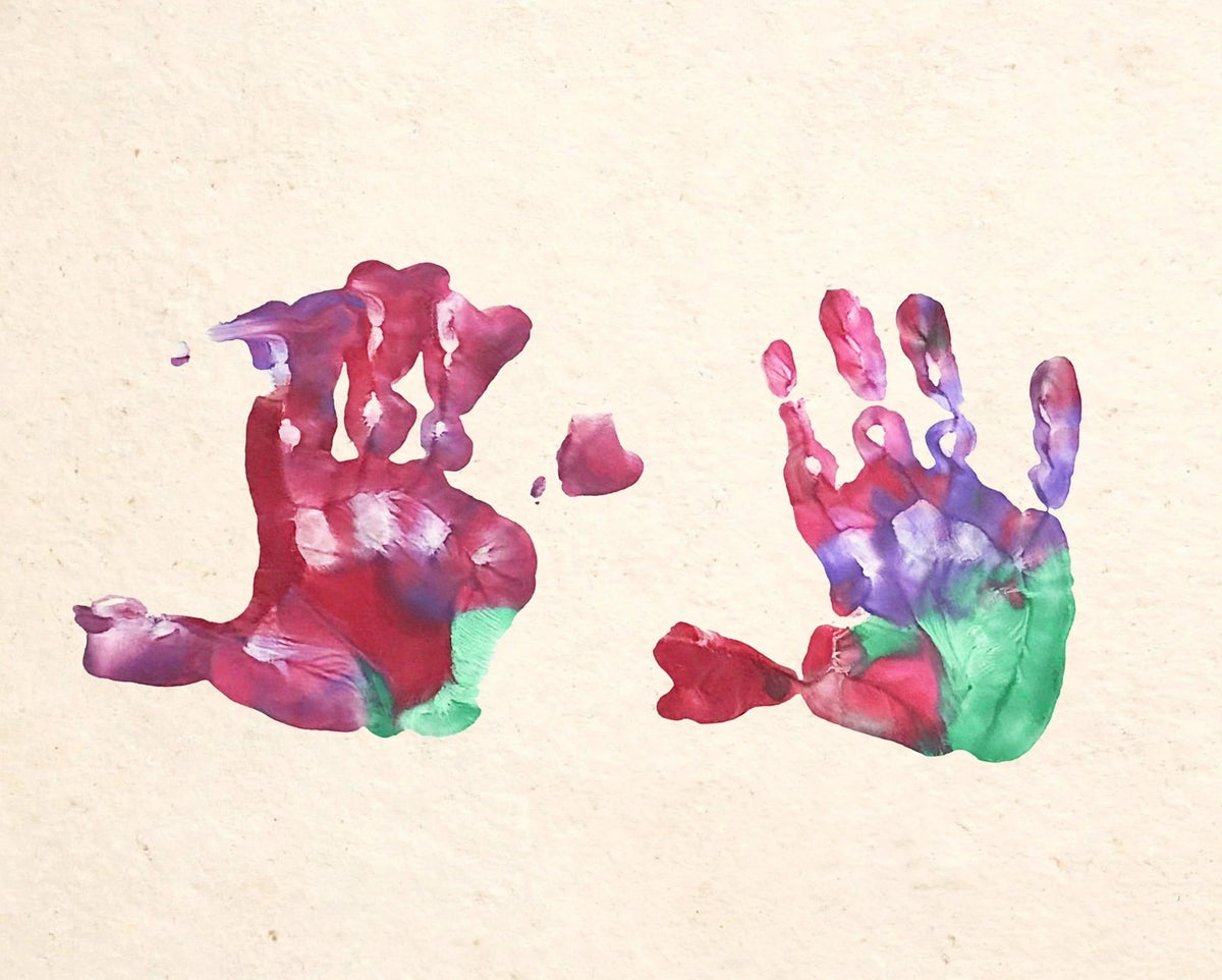 Colourful child handprints artwork